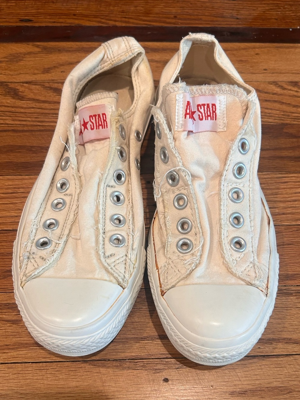Converse Slip-On Canvas Sneakers in Cream with Red Star Tag